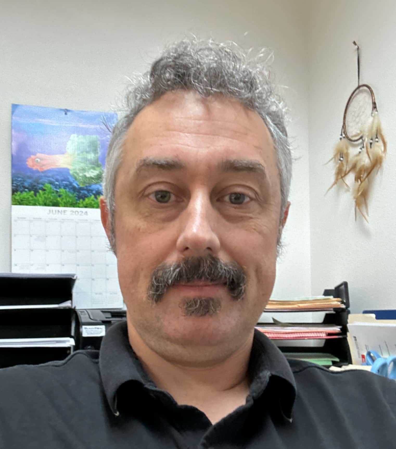 A portrait photo of James Bauckman